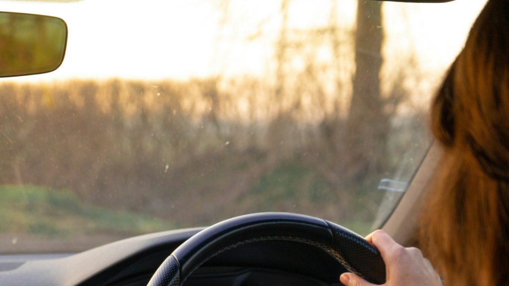 Right-hand-drive learner car interior on a UK street, suitable for a weekday intensive driving course around work.